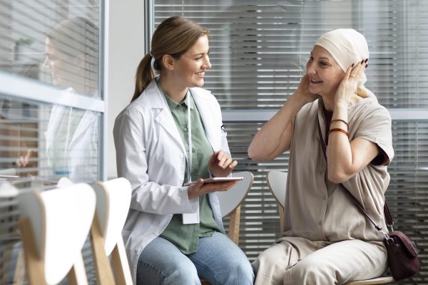 middle-aged-woman-with-skin-cancer-talking-with-her-doctor